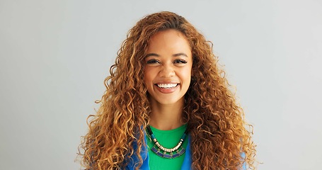 Image showing Woman, fashion and smile with necklace in studio on white background, happy and confident with trendy outfit. Closeup, female person and excited with clothes on colorful top with jewelry and style