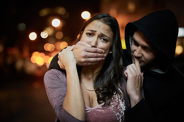 Image showing Woman, criminal and hand on mouth with fear for violence, danger and robbery in city at night with bokeh. People, portrait and silence emoji with terror, crime and stalker for kidnapping and hostage