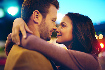 Image showing Couple, night and hug outdoor with happiness, nose touch and bonding for romance and sweet moment. Love, affection and people in commitment and trust, security and support together with time together