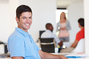 Image showing Casual, male person and smile in portrait at office with colleagues, working or job or happy. Businessman, company and confidence with coworkers at desk for events management, planner or coordinator