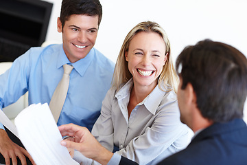 Image showing Businesspeople, colleagues or documents with smile or closeup in office, laugh and conversation or talking. Group of people, auditors or workplace or happy with discussion or financials, paper or joy