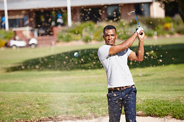 Image showing Man, golf ball and air with sand for sports, action and energy with club for game, competition and swing. Challenge, exercise and professional athlete with training, performance and leisure outdoor