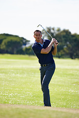 Image showing Man, golfer and swing with club on golf course for point, score or par in outdoor nature. Male person or sports player hitting ball on green lawn or grass field for competition, challenge or practice