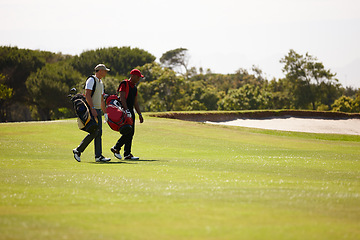 Image showing Men, walking and golf course for sports, game challenge and exercise for hobby in summer travel outdoor. Golfer or friends and talk with equipment near bunker for activity on field for vacation trip