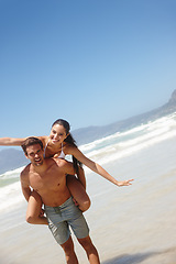 Image showing Couple, piggyback and portrait on beach with playing for bonding, summer vacation and anniversary getaway. Man, woman and love by ocean with mockup space for freedom, healthy relationship or blue sky