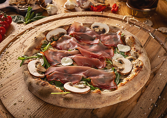 Image showing Gourmet prosciutto and mushroom pizza