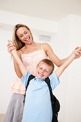 Image showing Happy, mother and boy with excited, fun and cheerful for first day of school in house or apartment. Woman, male child and home in joyful, playful and backpack for learning, development and growth