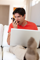 Image showing Man, angry and phone call in living room with laptop for business, entertainment or work from home. Person, notebook and mobile upset for communication, deal or conversation with network provider