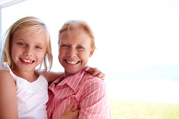 Image showing Portrait, grandmother and girl with generations at family house by embrace, bonding and love in garden. Grandma, people and child in outdoors on vacation at childhood home with nature for memory