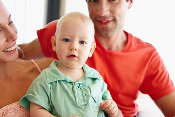 Image showing Parents, happy and hug baby in portrait at home for learning, development and bonding together. Mom, father and love child smile in living room for family, relationship or memories with each other