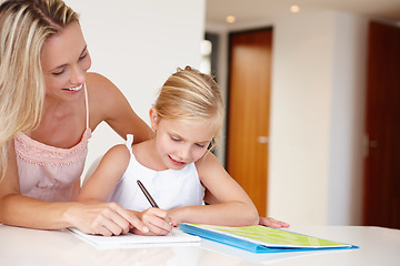 Image showing Mom, happy and child writing on notebook for development, learning or educational training. Woman, girl and book smile doing homework in living room for bonding, studying or tutoring after school