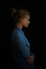 Image showing Woman, profile and thinking of calm thoughts on a dark or black background to remember a memory. Female model in studio as wise, inspire and casual outfit with a smile, arms crossed and pensive