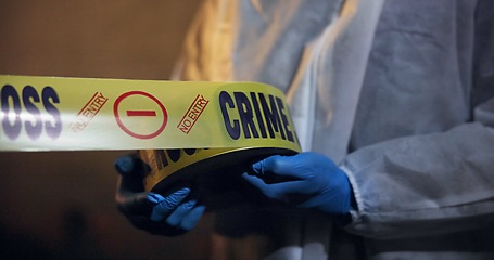 Image showing Police, hands and yellow tape for crime scene, investigation and barricade in night for warning, danger or sign. Forensic inspection, person or detective with security for robbery, murder or no entry