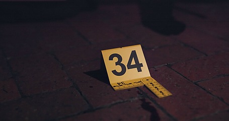 Image showing Crime scene, investigation and blood on floor for evidence, forensics and dna for pathology research. Marker, security and yellow sign with number for warning, caution and incident on red bricks