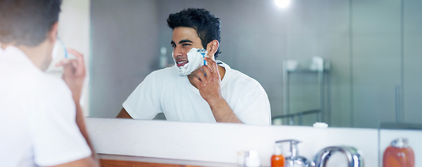 Image showing Shaving cream, mirror and man in bathroom for hygiene, grooming and washing face at home, house and apartment. Male person, gen z guy and reflection of student with foam, banner and skin care routine