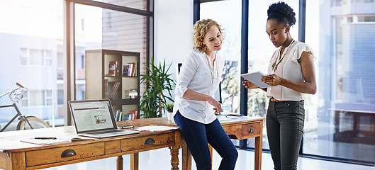 Image showing Business people, women and tablet with brainstorming, conversation and startup with research in a modern office. Teamwork, staff and employees with technology and creative agency with PR consultant