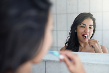 Image showing Brushing teeth, dental and hygiene with girl for healthcare, wellness and fresh by mirror in bathroom. Health, tooth whitening, gum care and cleaning mouth with woman as morning routine at home