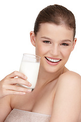 Image showing Portrait, woman and healthy diet by drinking milk in studio for calcium, nutrition and protein with detox benefits. Happy, female person and dairy product smoothie with natural vitamins for wellness