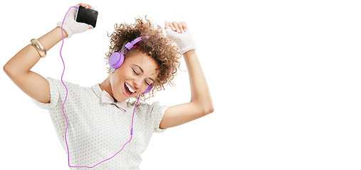 Image showing Woman, energy and dancing with smartphone, headphones for music and happiness isolated on white background. Excited, moving and listening to radio playlist for fun, mockup space or banner with joy