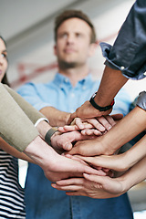 Image showing Group, team and unity with hands together at office for collaboration, synergy or agreement. Closeup of people or creative employees piling for motivation, help or startup in solidarity at workplace