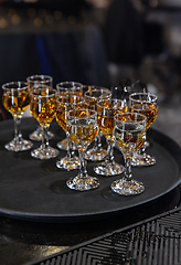 Image showing Elegant glasses of amber liquor