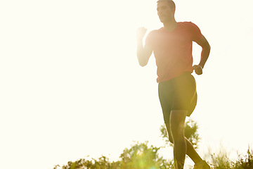 Image showing Man, outdoors and trail running with athlete for training with endurance for physical fitness. Male person, cross country and back with lens flare for routine, race and performance in balance