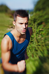 Image showing Man, speed and trail running in nature for fitness, exercise and workout with motivation. Male athlete, runner and training outdoor for sports, health and wellness or cardio during summer with vest