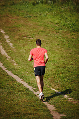 Image showing Man, trail running and outdoors with athlete for endurance with training for physical fitness. Male person, cross country and back for workout routine, race and drill for performance in balance