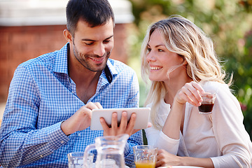 Image showing Happy couple, smiling and tablet in garden for breakfast, internet and scrolling on social media. Male person, woman and outdoors at home for mobile games, meme and drinking coffee in the morning.