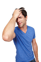 Image showing Frustrated, man and pain from headache in studio for anxiety, depression, burnout and mental health issues. Stressed, person and standing with extreme migraine problems in isolated white background