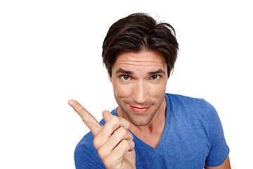 Image showing Man, pointing for advertising and mockup in portrait, information or announcement with news on white background. Marketing, promotion or direction with notice, sign or presentation with coming soon