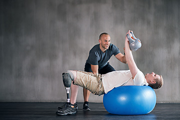 Image showing Trainer, man with a disability and prosthetic leg and dumbbell in physiotherapy, studio and gym ball. Male people, physiotherapy and amputee for wellness, fitness and exercise in rehab center