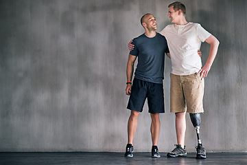 Image showing Physiotherapist, person with a disability and prosthetic leg and dumbbell in physiotherapy, studio and gym ball. Male people, trainer and amputee for wellness, fitness and exercise in workout session