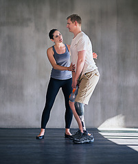 Image showing Man, woman and physiotherapy for prosthetic, amputee and leg at rehabilitation, training and exercise. Physiotherapist, patient and fitness for workout, dumbbell and gym for man with a disability