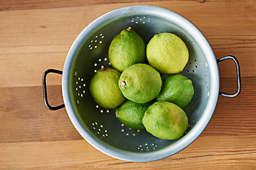 Image showing Top view of fruit, lime and healthy food for snack, nutrition and wellness with citrus for vitamin c or detox. Organic ingredients, fresh green produce and balance in diet, sweet or sour for juice