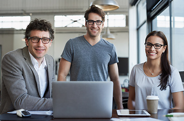 Image showing Portrait, happy people and laptop at agency for meeting with collaboration, office and web design. Technology, teamwork and face of employees in workplace for creative startup, happiness and internet