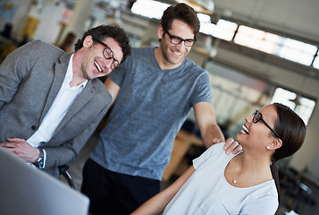 Image showing Team, laptop and happiness in office with laughing, cheerful and joyful for company as colleagues. Businesspeople, group and employees in workplace, corporate and technology for meeting or teamwork