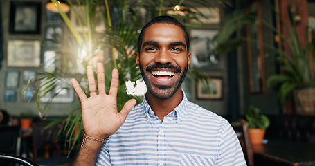 Image showing Wave, video call and face of black man in coffee shop for communication, contact and talking. Remote work, freelancer and portrait of person greet hello for online meeting, webinar and discussion