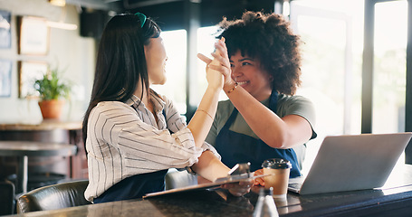 Image showing Cafe, success and catering team high five with laptop, tablet and startup loan approval celebration. Restaurant, small business and server people with hands together for victory, achievement or win