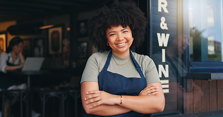 Image showing Happy black woman, cafe and owner by door of small business in confidence for management. Portrait of young African female person or waitress smile with arms crossed of professional at coffee shop