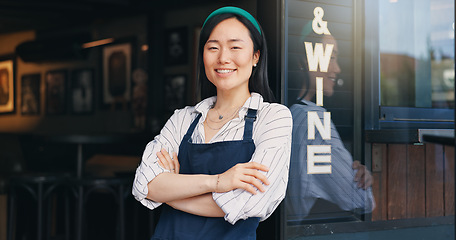 Image showing Happy asian woman, cafe and small business owner by door in confidence for management. Portrait of young female person or waitress smile with arms crossed by professional restaurant or coffee shop