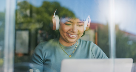 Image showing Woman, headphones and happy with laptop, remote work and streaming music playlist for online and internet. Creative, worker and network for freelance career, copywriter and working on social media ca