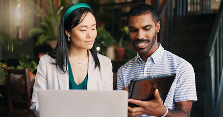 Image showing Business people, laptop and tablet at cafe for research, schedule planning or design in creative startup. Happy man and woman working with technology on project, brainstorming or ideas at coffee shop