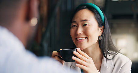 Image showing Happy asian woman, friends and coffee at cafe for conversation, catch up or break together. Young female person talking to man with smile or cup of tea for friendly discussion at indoor restaurant