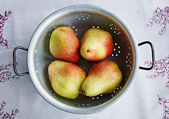 Image showing Food, fruits or bowl of pears in kitchen for fiber, organic or balanced diet for nutrition, meal or vitamin c. Background, above and healthy natural ingredients for vitamins, fresh or raw produce