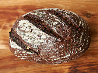 Image showing Loaf, bread or bun on a bakery kitchen or table for healthy breakfast, lunch or food in restaurant. Closeup, background or fresh homemade roll for carbohydrates or fiber or vitamins in meal or diet