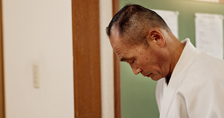 Image showing Aikido, sensei and bow with respect for Japanese history, culture and martial arts at traditional gym. Mature man, aikidoka with humble greeting or custom welcome to challenge, class or fight at dojo