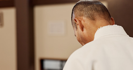 Image showing Aikido, student and man bow in respect for martial arts, class or walking in traditional gym. Japanese, sensei and mature fighter with humble greeting, master or welcome to competition with kindness