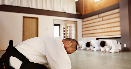 Image showing Aikido, students and bow to master in dojo for martial arts practice, discipline or class in self defense. Japanese, respect and teaching combat in education, training or workout for fighting in club