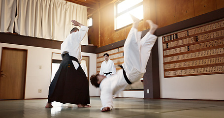 Image showing People, dojo and sensei with student in self defense or training for fight or challenge with master. Man, teacher and martial arts class in Japan for practice lesson, aikido or team battle in Tokyo